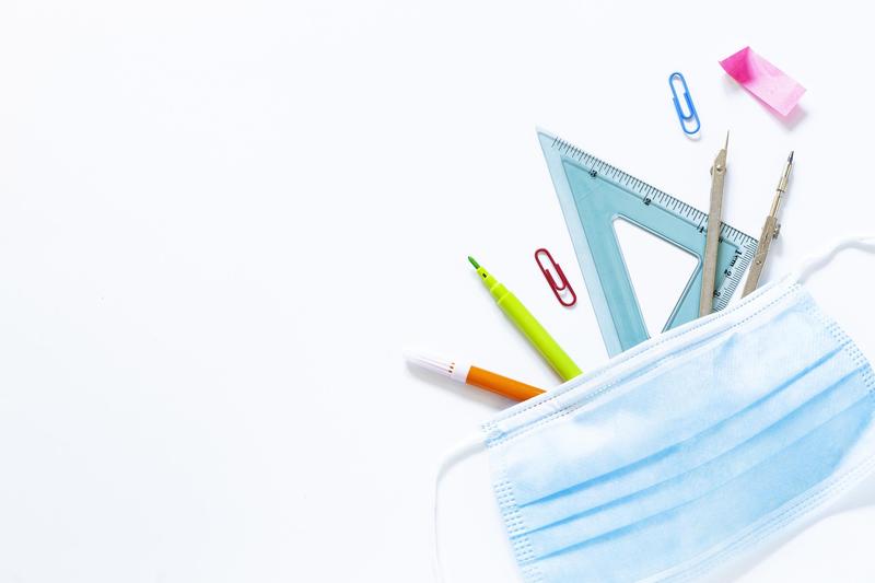 Mask with an assortment of school supplies