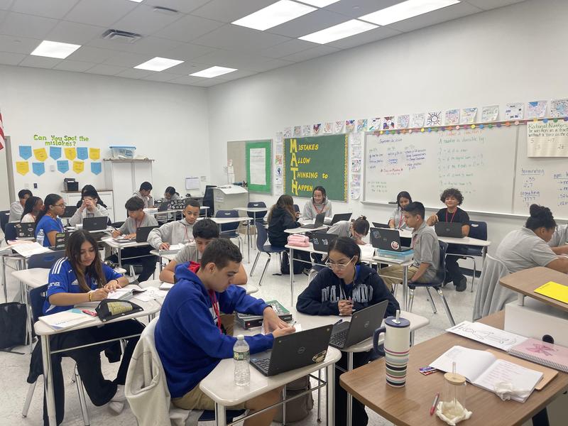 students sitting in class working on projects