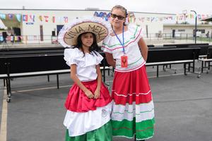 Two girls in cultural dress standing outside at Hyatt WLA.