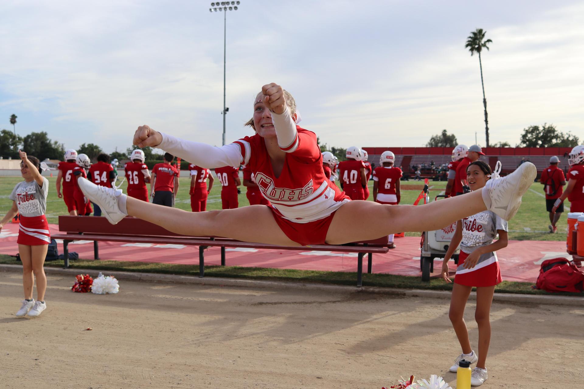 junior varsity cheerleaders in action at the Riverdale game