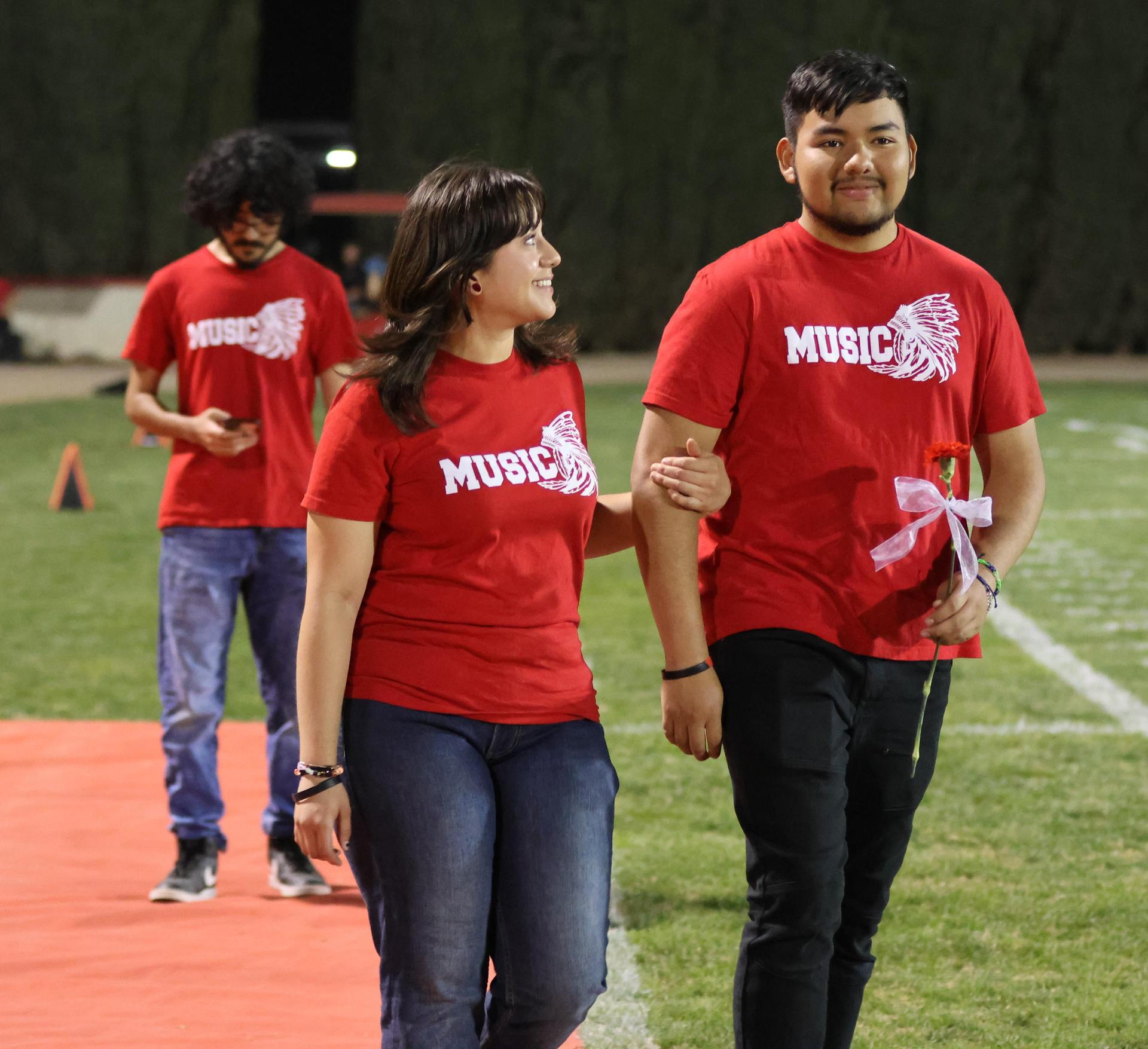 seniors and their escorts celebrating senior night