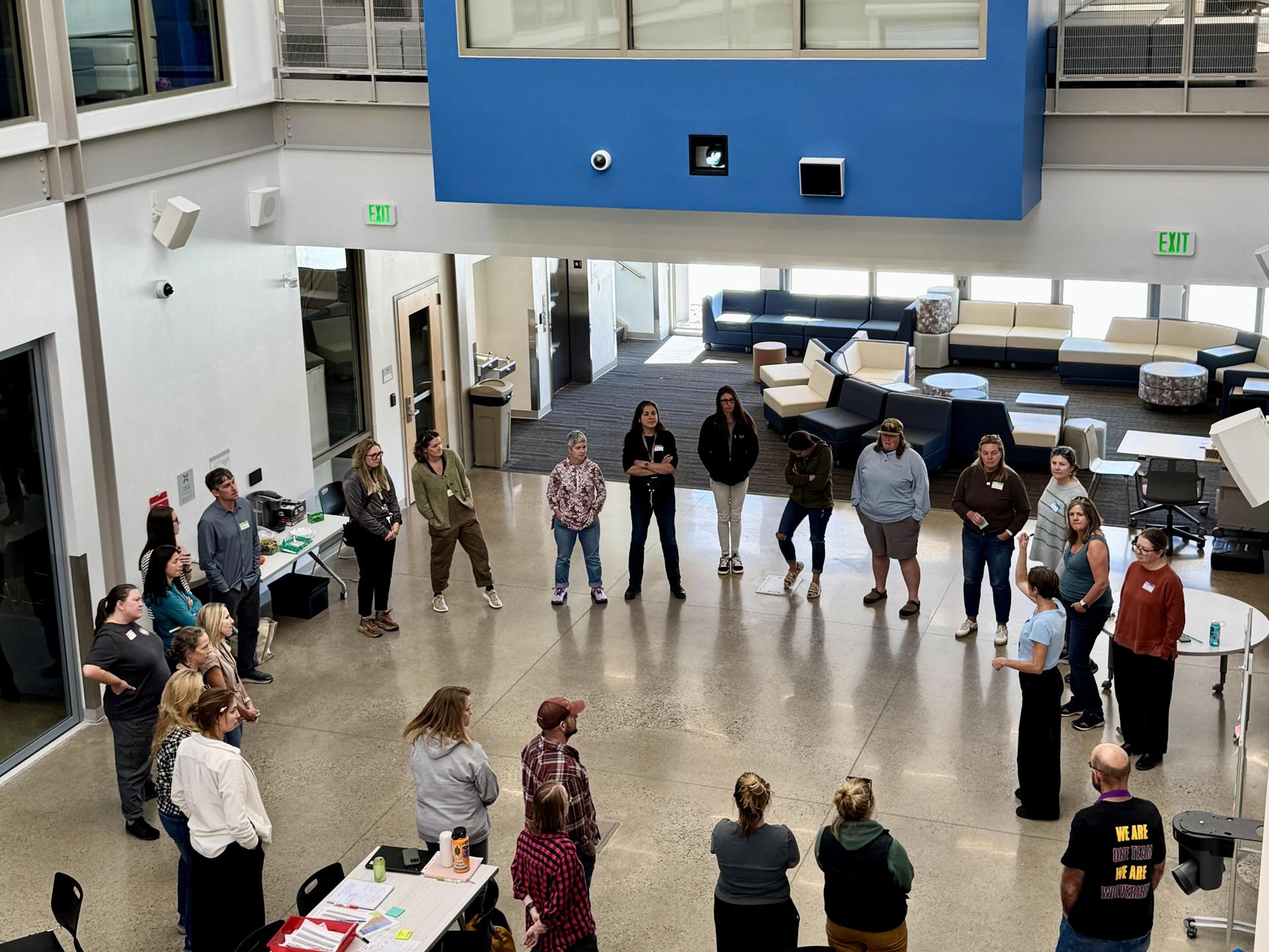 People standing in a circle and talking