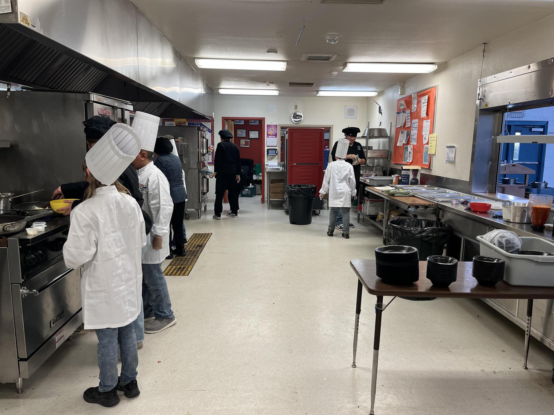 all students working individually in kitchen