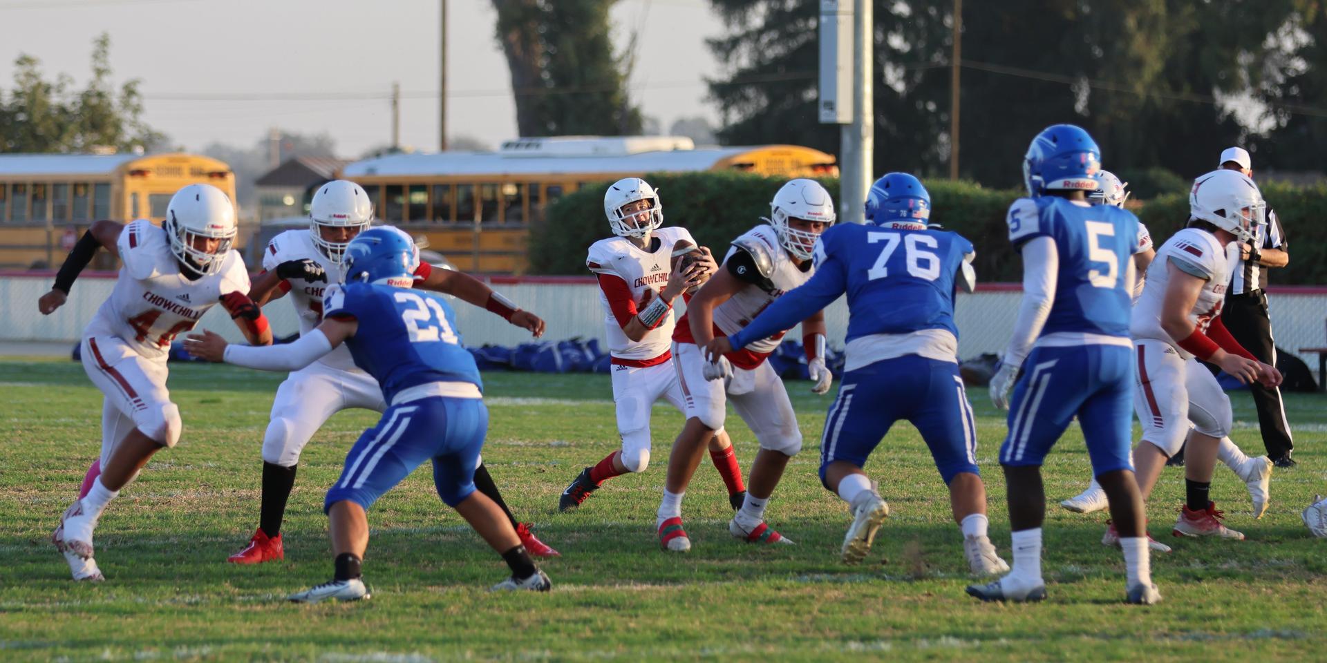 Junior Varsity football players in action against Caruthers