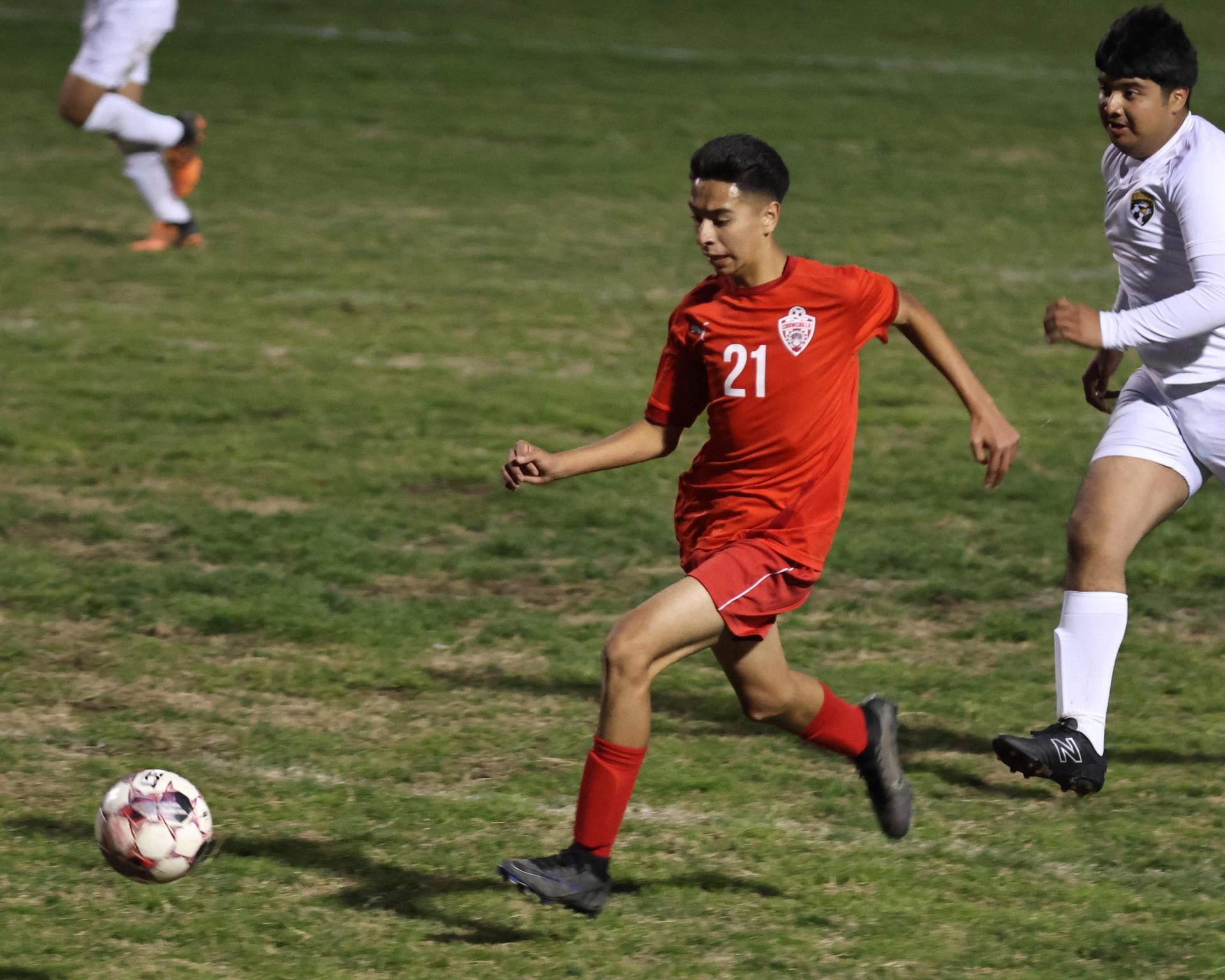 Junior Varisty boys playing soccer against Kingsburg