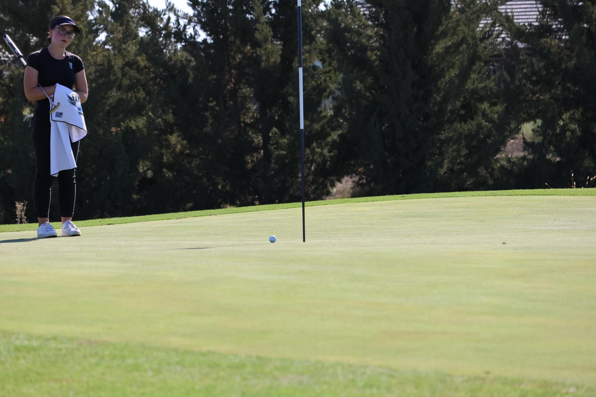 another golfer in asterisks pairing watching