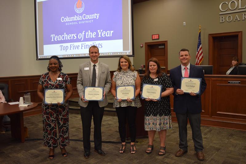Top 5 Finalists for District Teacher of the Year holding certificates