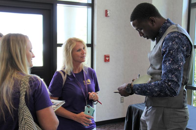 Michael Bonner (right) signs books for B-L Primary School teachers Erika Smith (center) and Kelly Johnson (left). Mr. Bonner, a nationally-known teacher and visionary leader, served as the keynote speaker for the Back-to-School Convocation for staff in Lexington Three and Saluda County school districts.