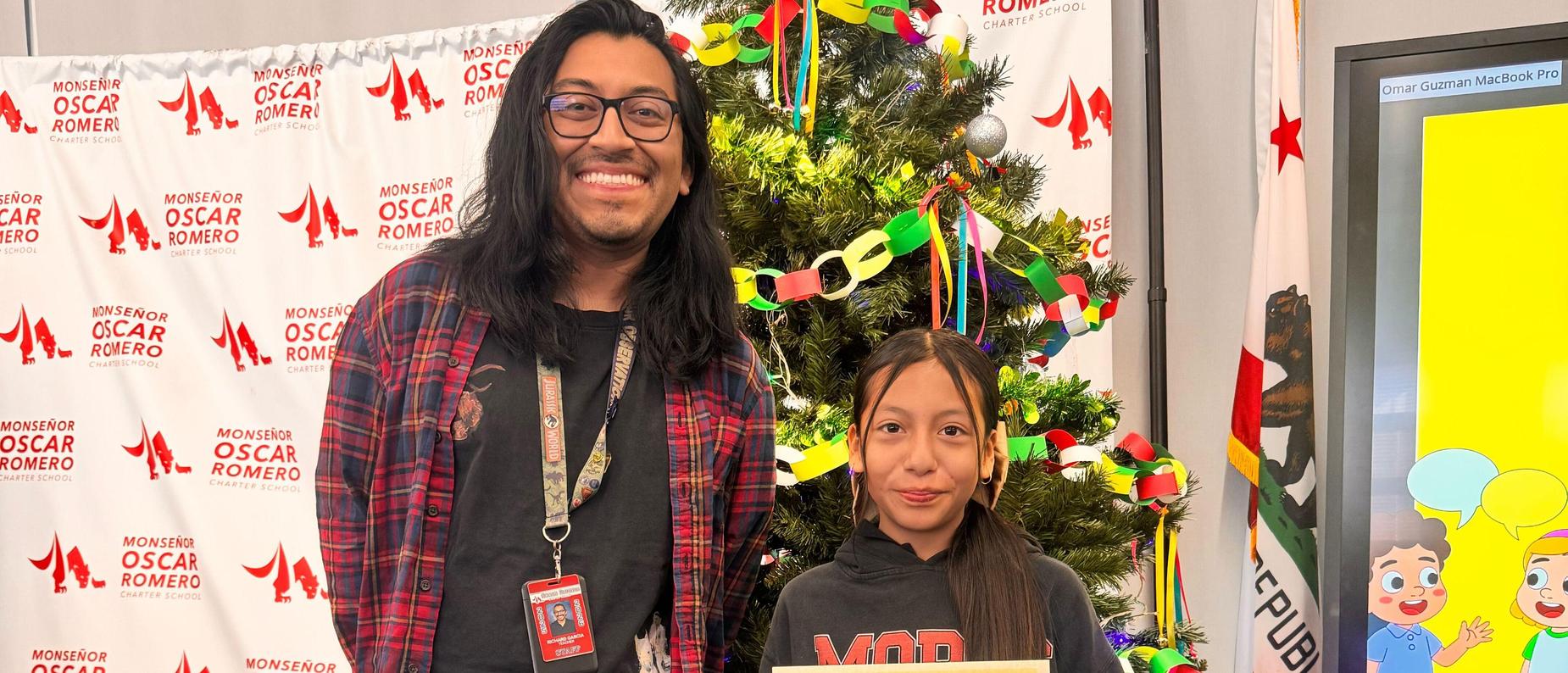 Mr. Garcia and one of our 6th grade Scholars - 6th Grade Awards Assembly