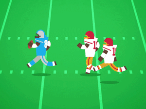 Football players running across field