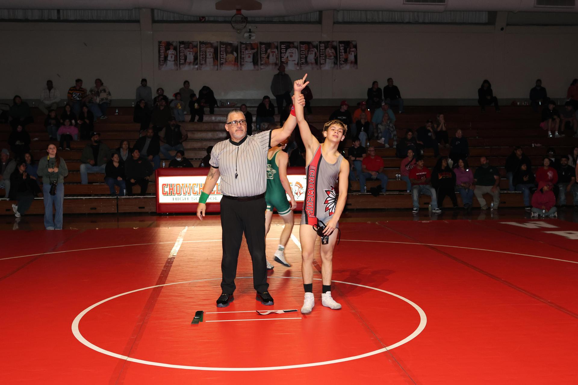 Wrestling winners with hands up 115