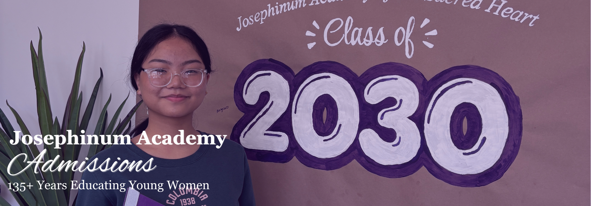Admissions Banner - student standing in front of 2030 signage
