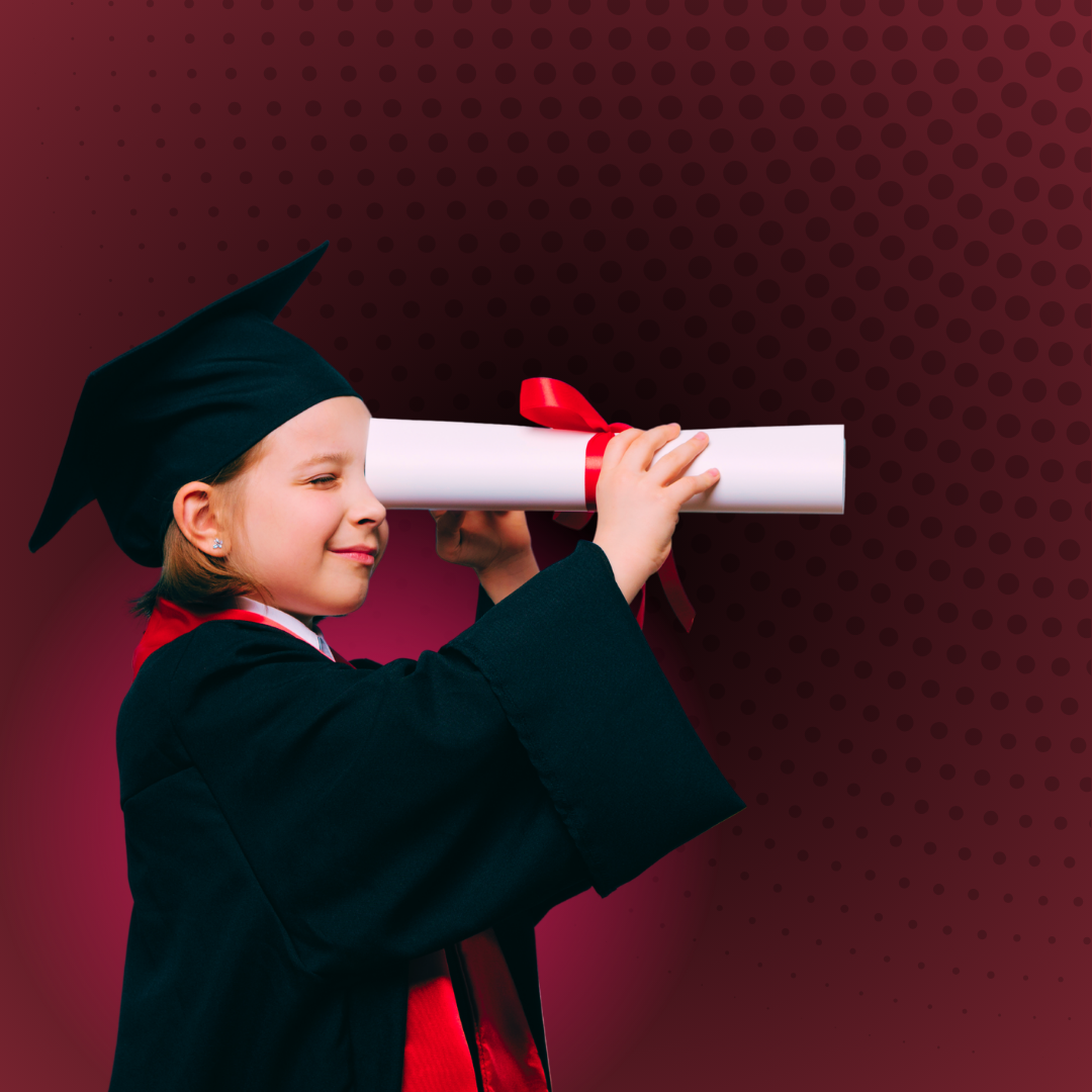 Child in graduation cap and gown looking through diploma