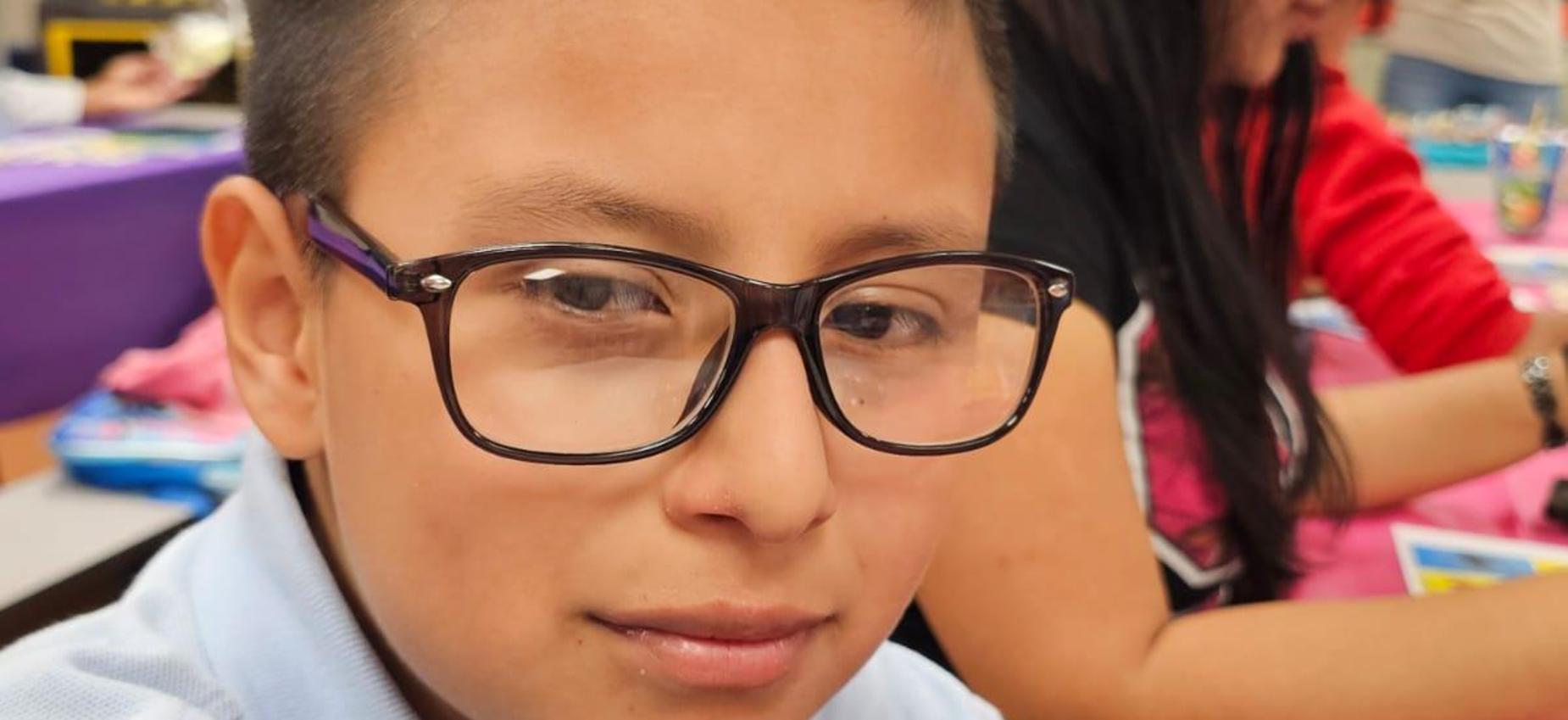Student looking into the camera.
