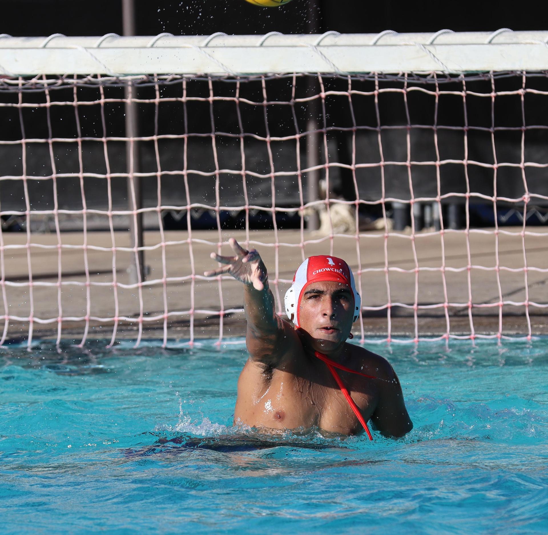 boys water polo players in action against san joaquin memorial