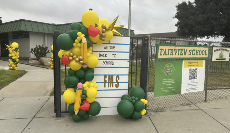 front of Fairview Middle School decorated with ballons to welcome students back to school.