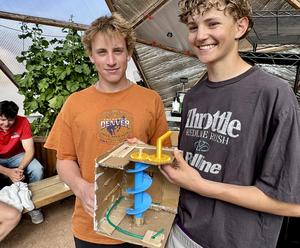 Students demonstrate a device