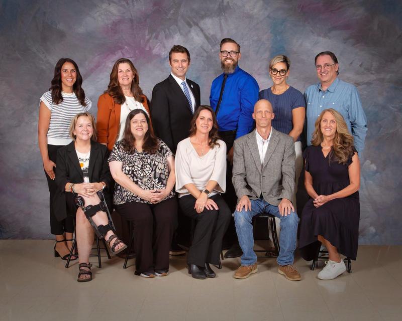 A group of teachers seated for a formal portrait