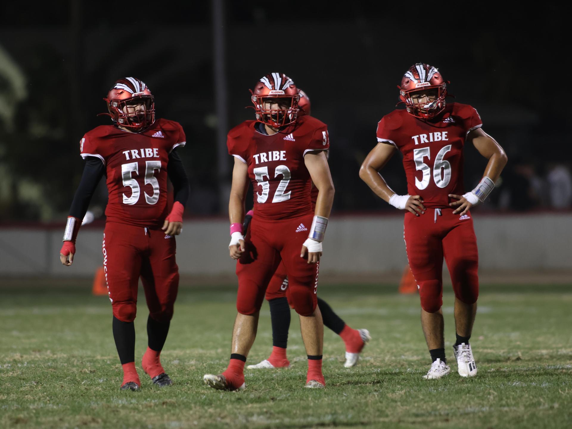 varsity boys playing football against Fowler