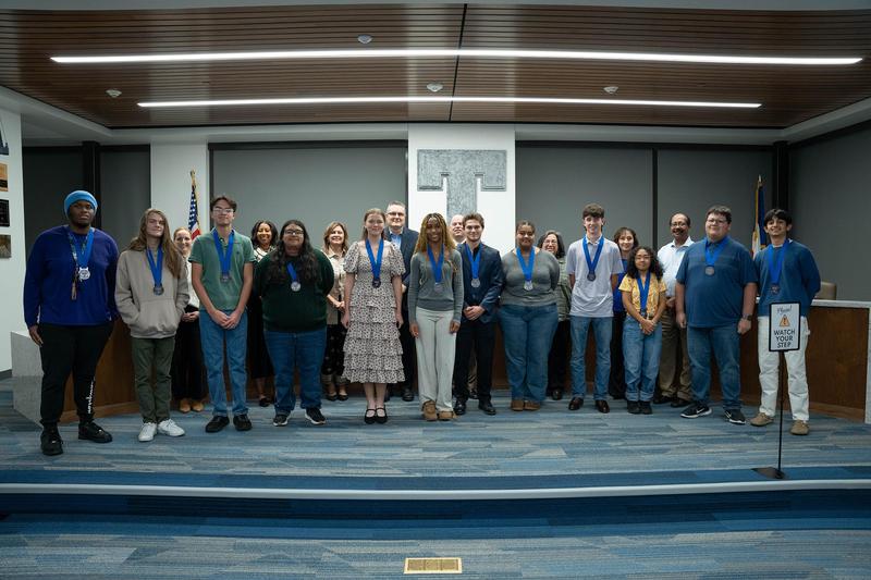 College Board recognition honorees pose with the TISD Board of Trustees