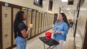 Student with Ms.Mason answering questions.