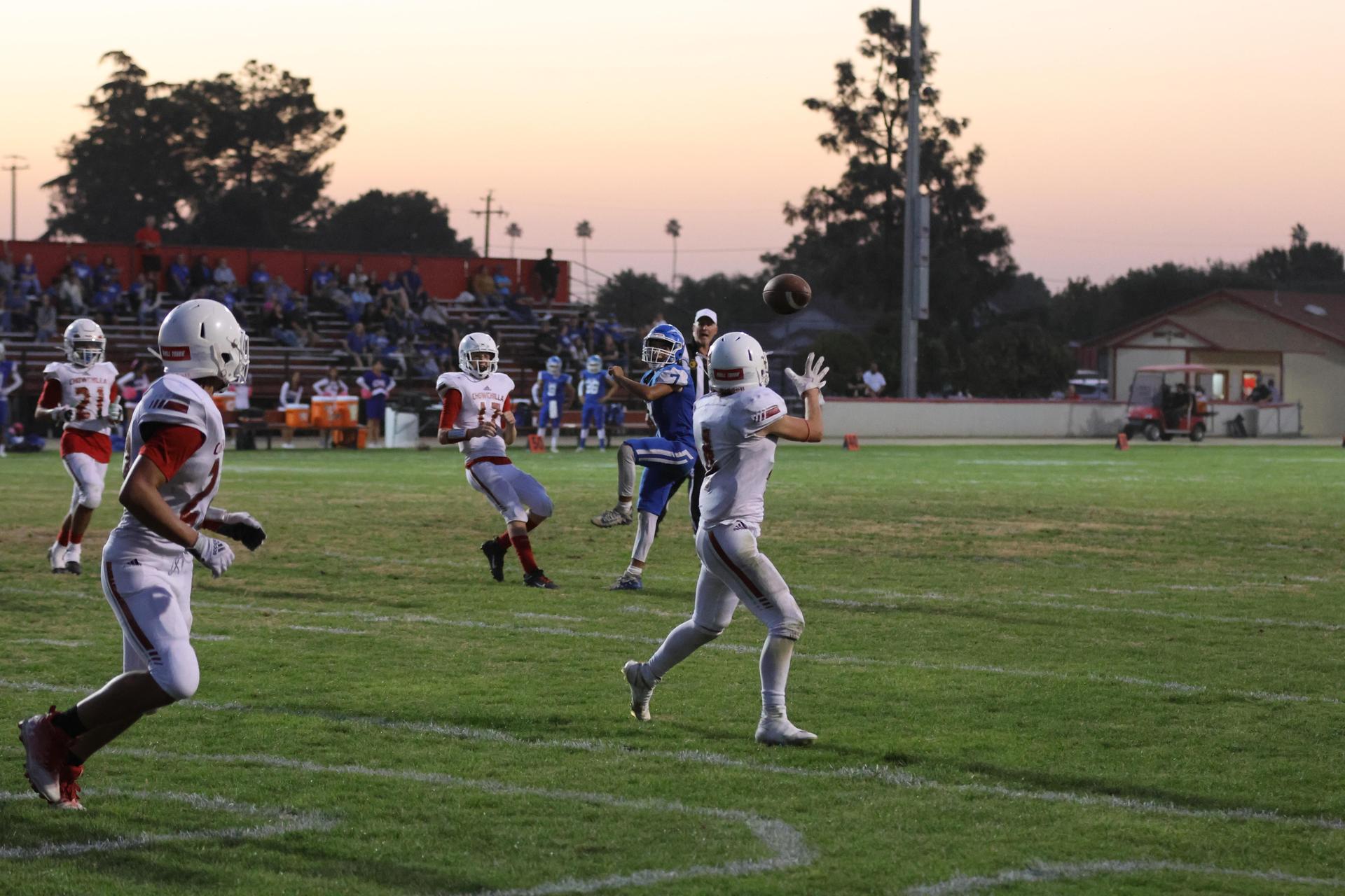 Junior Varsity football players in action against Caruthers