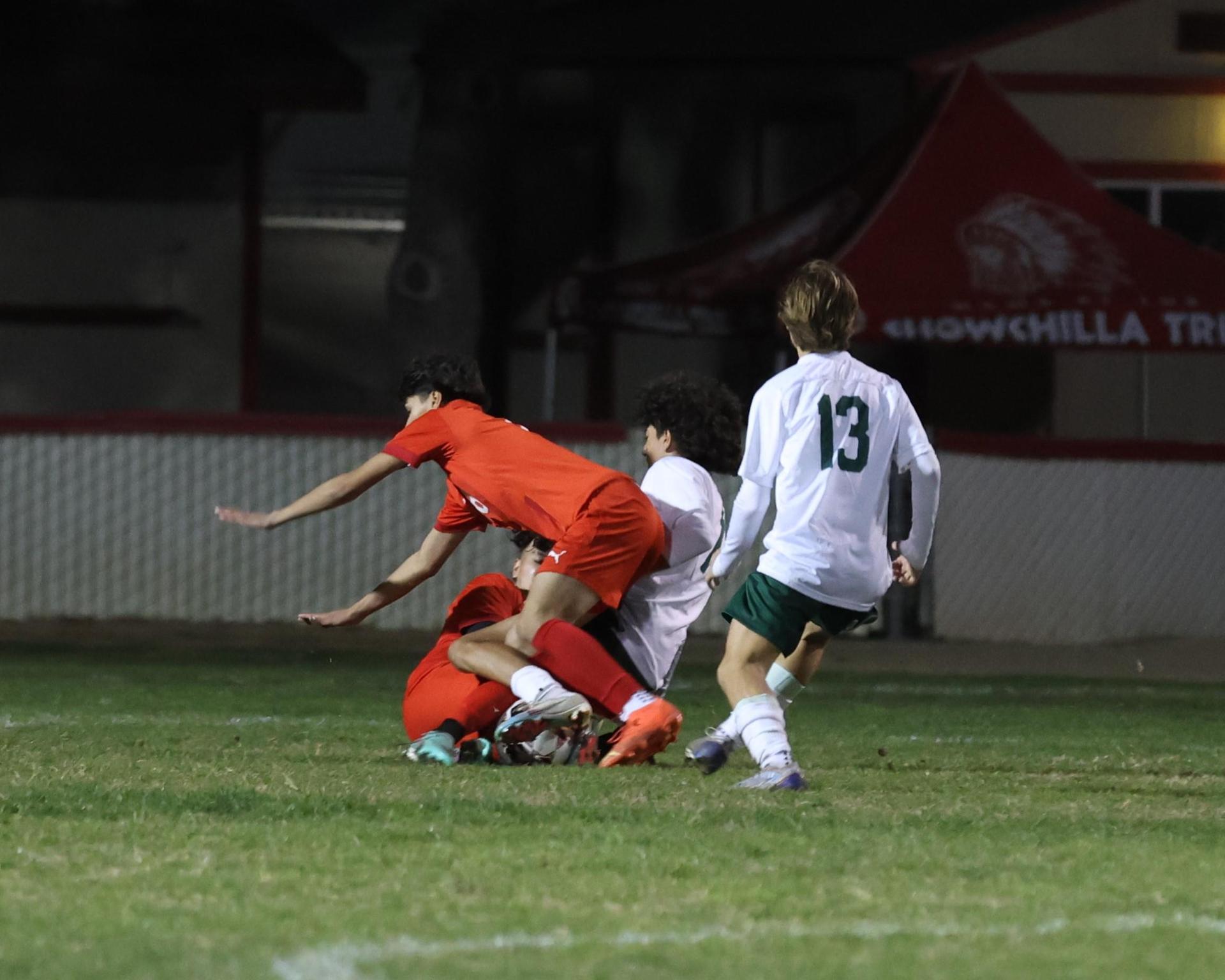 Varsity boys play soccer against Kingsburg