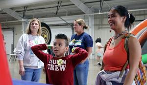 student playing football