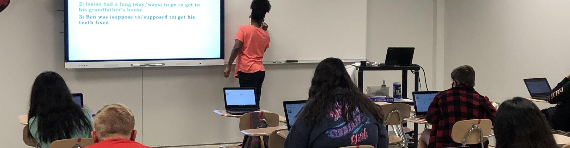 Mrs. Wingfield's Class doing a bell ringer on proper sentences.