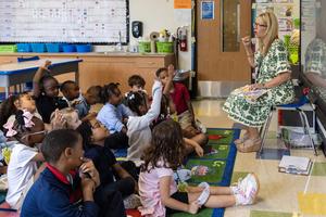 An elementary teacher reads to her class