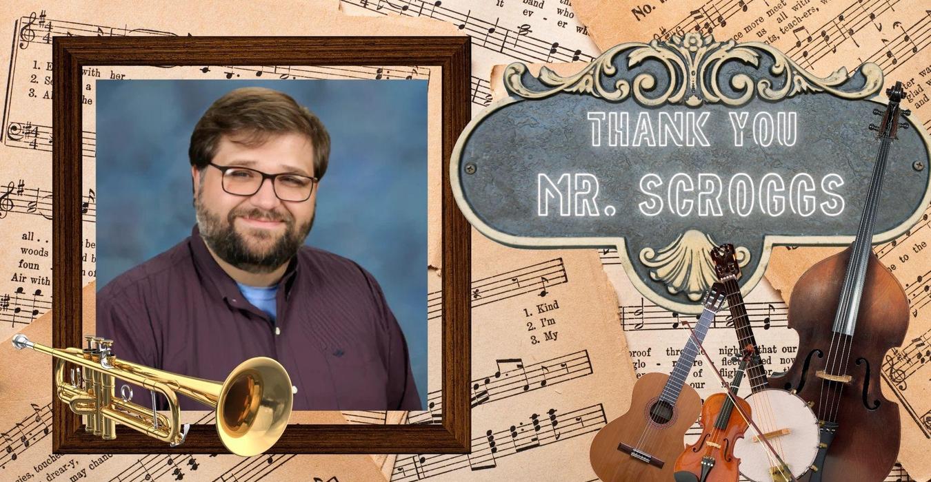 A framed portrait of a man with musical instruments and sheet music in the background.