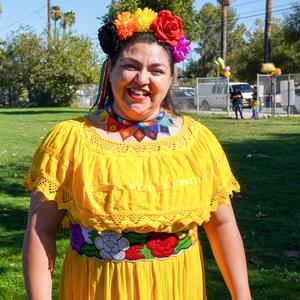 Woman dressed in bright yellow cultural dress