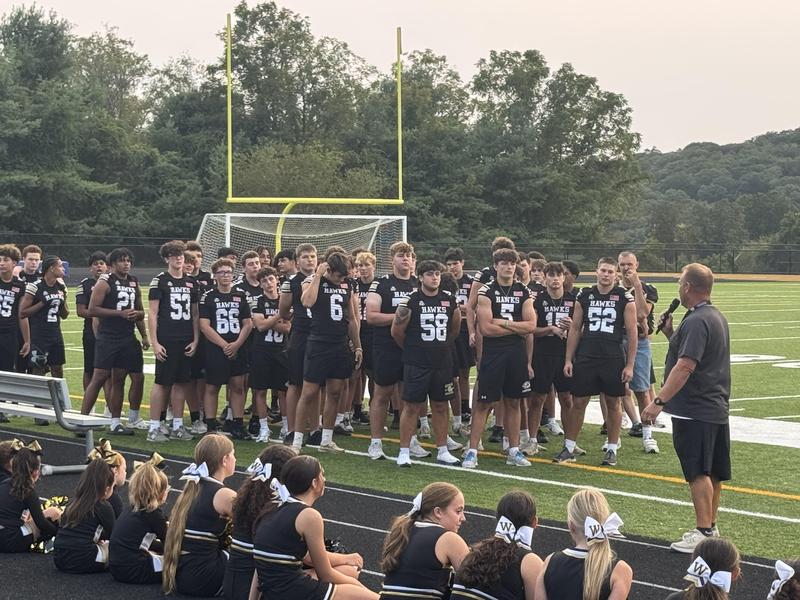 football team at pep rally