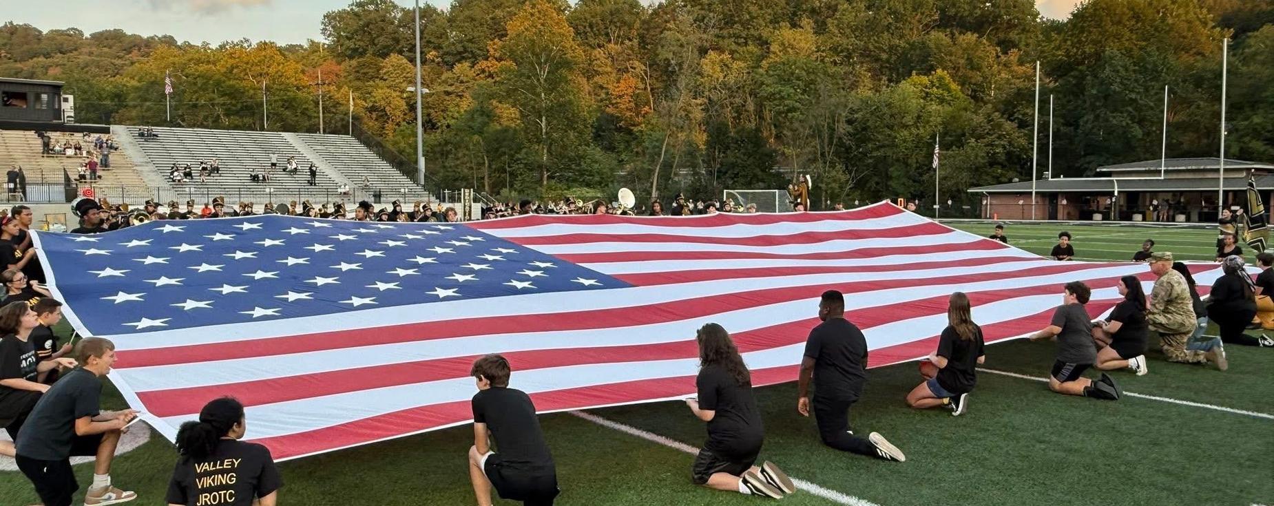 Valley students holding the American flag