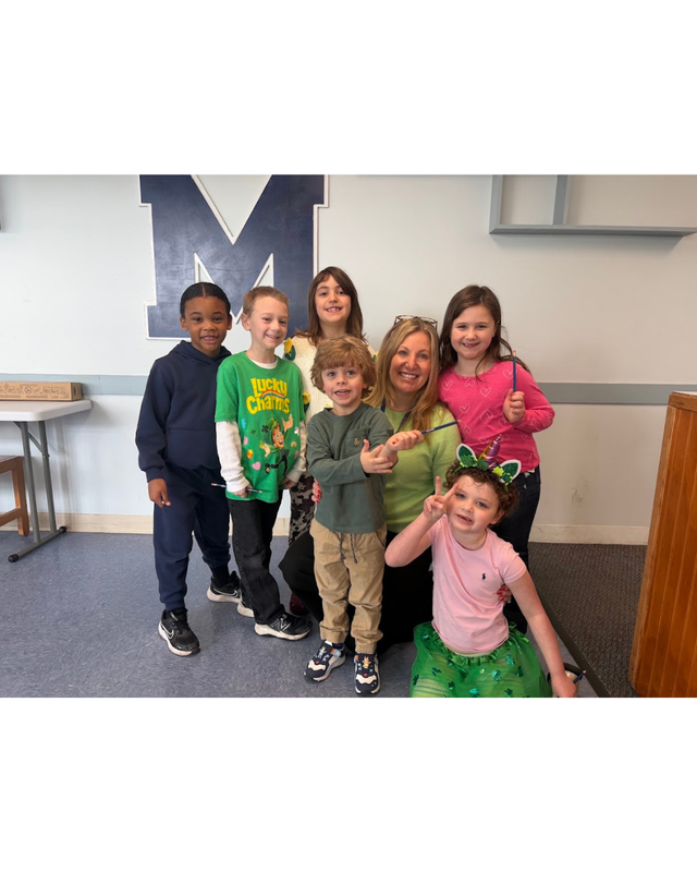 Principal Redman surronded by students