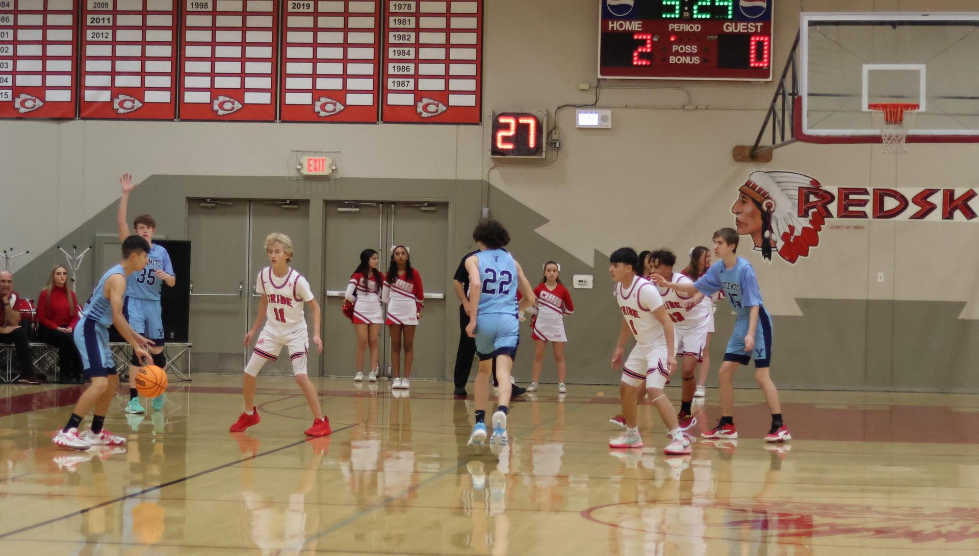 junior varsity boys playing basketball against yosemite