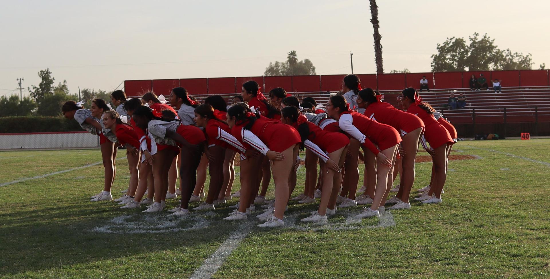 Cheerleaders performing at the football game