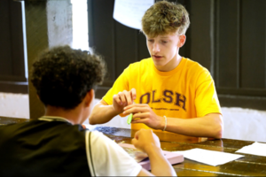 OLSH Newman Scholar volunteering with a Mooncrest student at Youthtowne