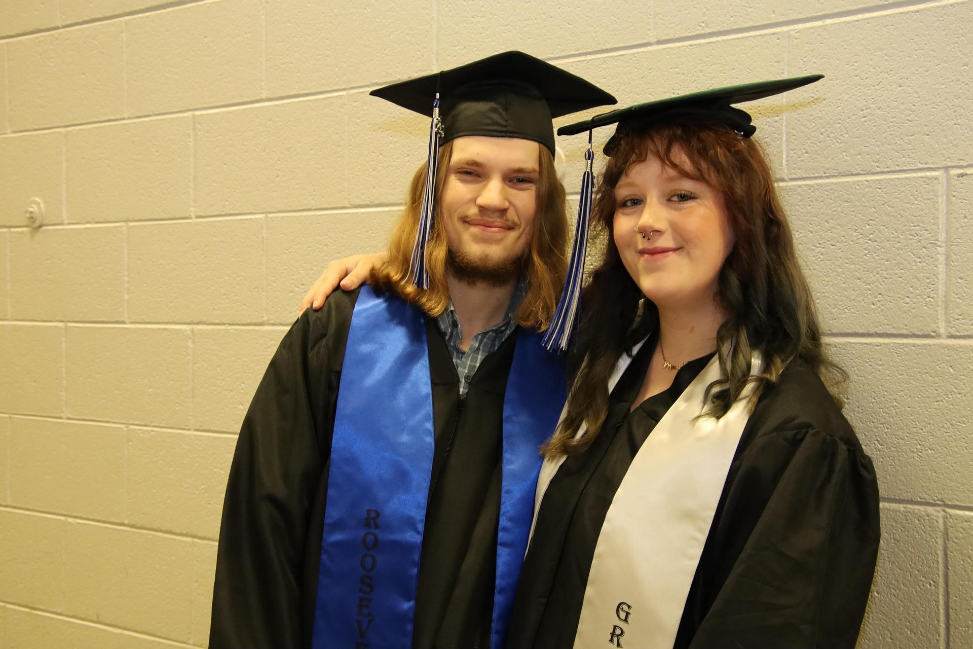 Roosevelt graduates smiling for the camera