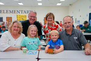 Family and two students at Legacy Grandparents Bingo Event