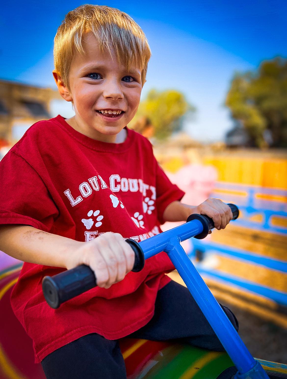boy on fun ride