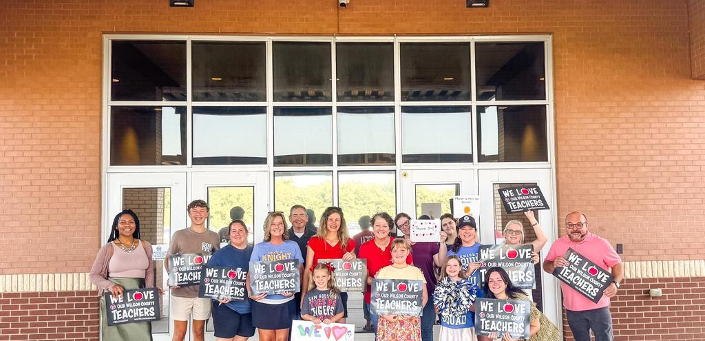 Community members greeting teachers on their first day back of the 2025-2026 school year.