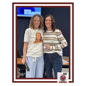 Two women smiling.