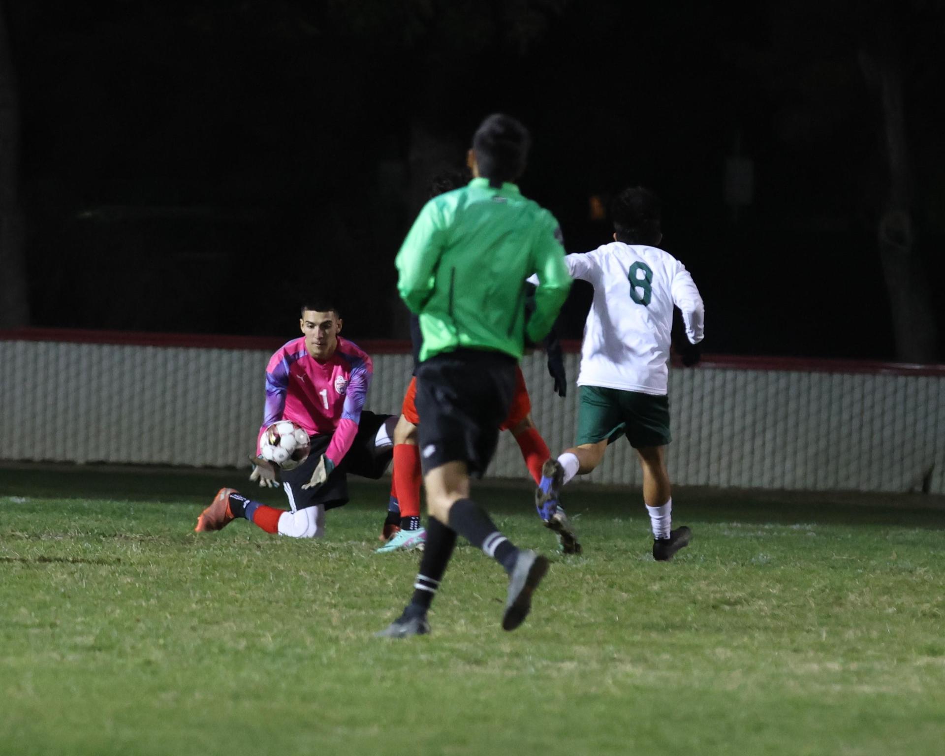 Varsity boys play soccer against Kingsburg