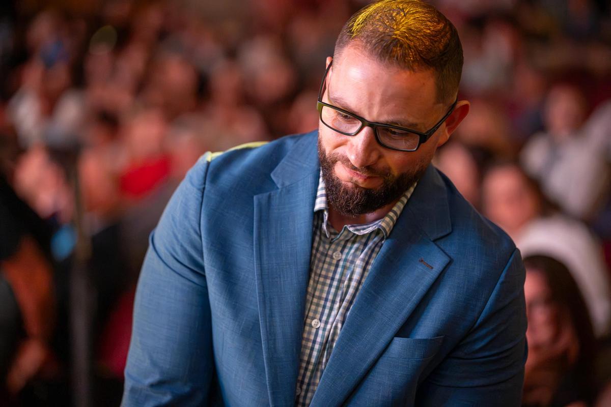 Close crop of a man in a blue blazer and a dress shirt