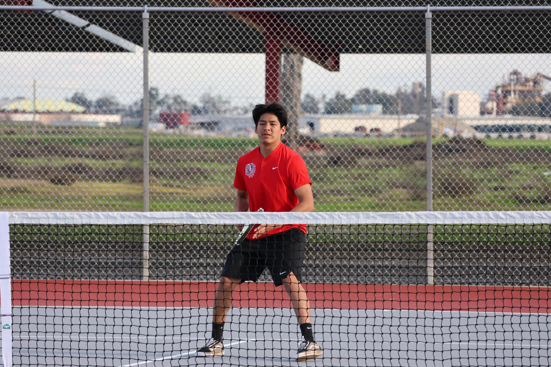 CUHS Boys playing tennis against coalinga