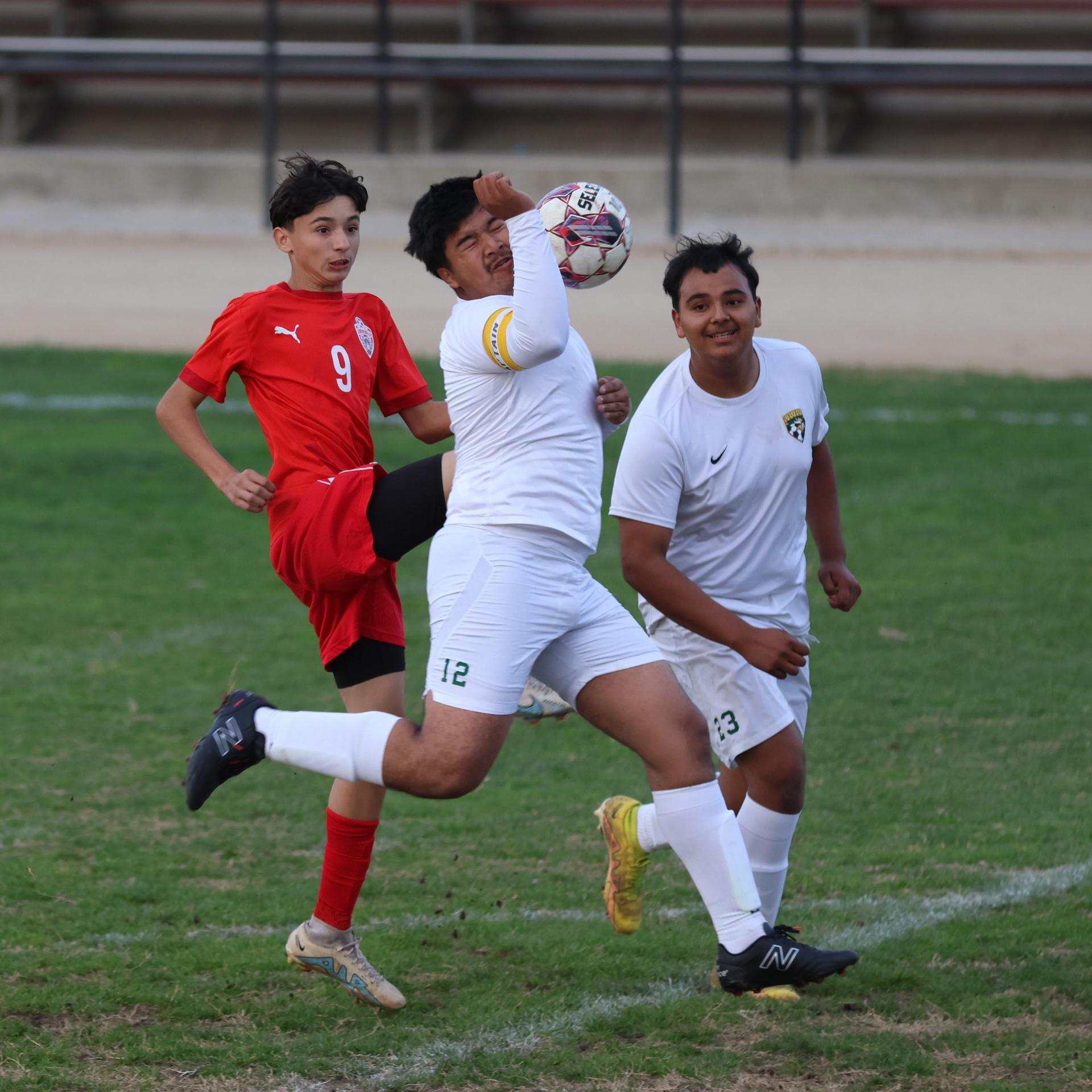 Junior Varisty boys playing soccer against Kingsburg