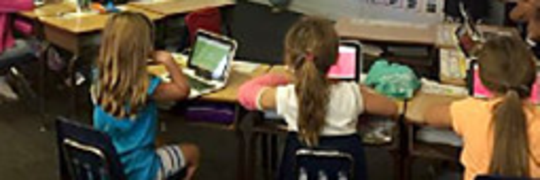 ges students working with tablets