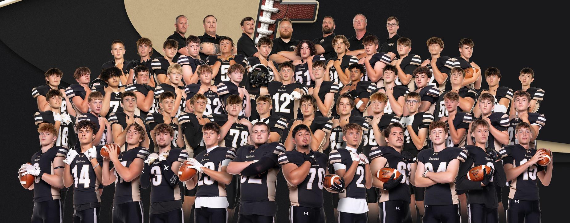 Large group photo of Fredericktown football team in black and white uniforms.
