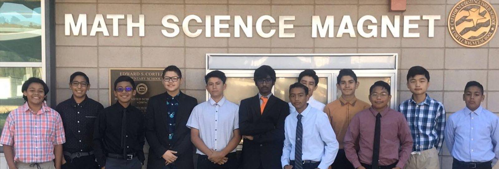 Students pose in front of Cortez
